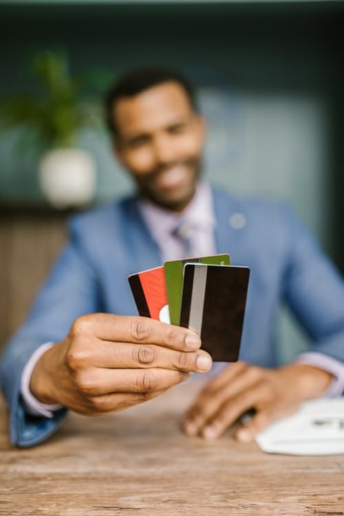 Free Man in Blue Suit Holding Credit Cards Stock Photo